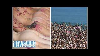 'STRIP and DIP' World record naked swim as 2,500 women bare all for the BEST reason