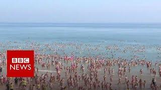 World record set for largest skinny dip - BBC News