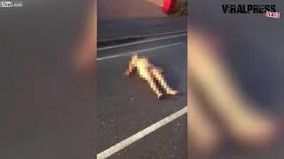 Live Leak: Naked woman lying on the road