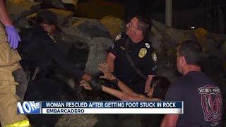 Half-naked woman rescued after getting foot stuck in rock